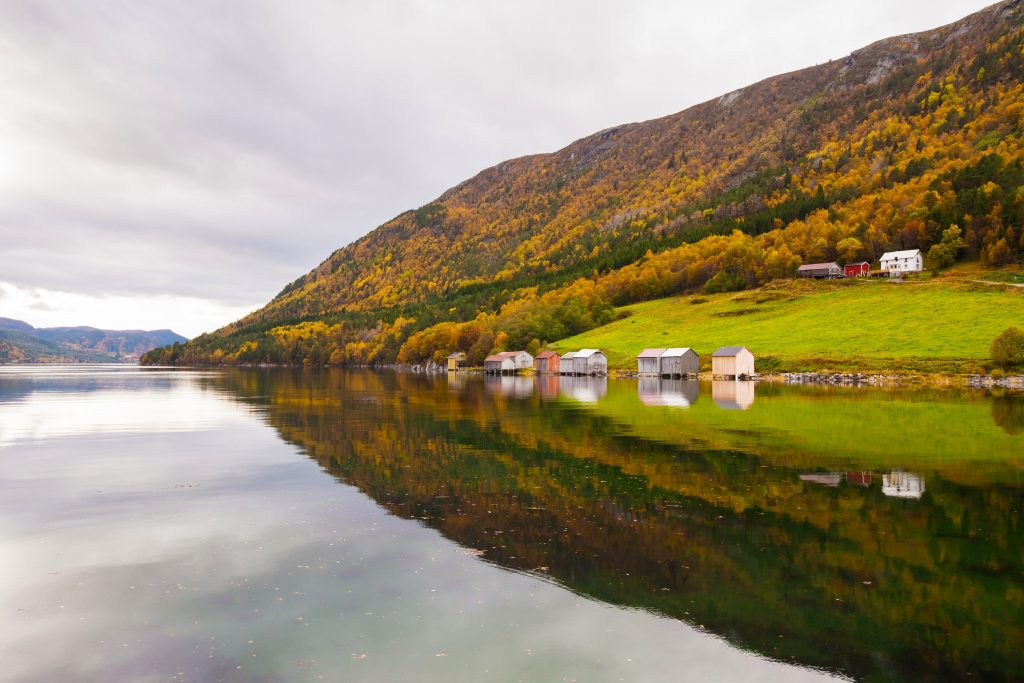 rural landscape with houses near river nor